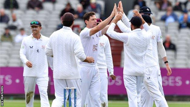 Matt Henry (centre) has played just two County Championship games for Kent this summer, recording best figures of 5-45 against Lancashire