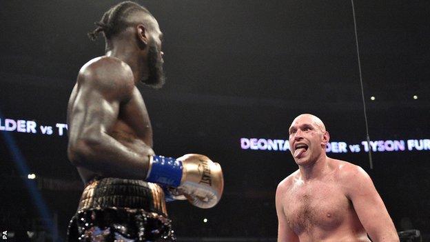 Tyson Fury in action against Deontay Wilder in the heavyweight fight in Los Angeles