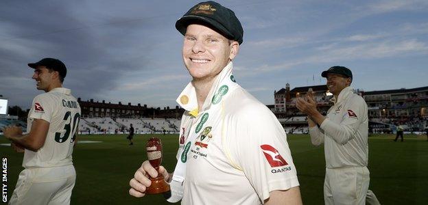 Australia batsman Steve Smith smiles as he holds up the urn after the final Ashes Test against England at The Oval