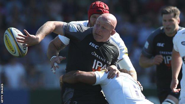 Newcastle hooker Scott Lawson offloads the ball