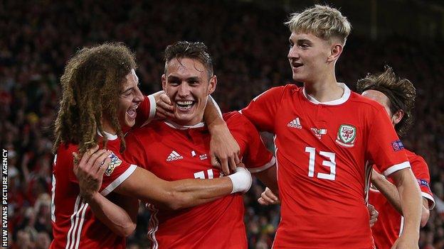 Connor Roberts (centre) celebrates his first goal for Wales in the win over the Republic of Ireland