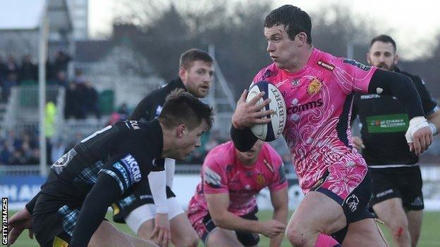 Exeter centre Ian Whitten evades a a tackle to score