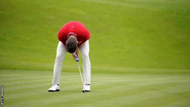 A golfer looks distraught