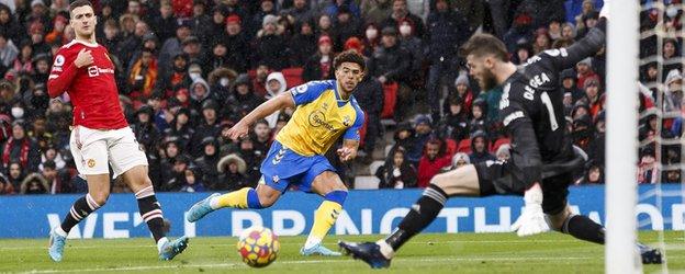 Che Adams scores against Manchester United