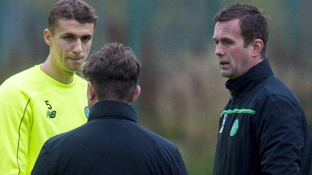 Celtic's Jozo Simunovic and Ronny Deila talk during training