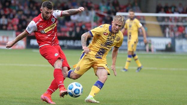 Cliftonville's Jamie McDonagh battles with DAC goalscorer Dominik Veselovsky