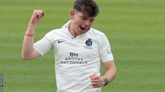 Middlesex bowler Ethan Bamber celebrates a wicket