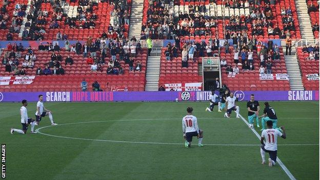 Players take a knee before the international friendly between England and Austria at Middlesbrough