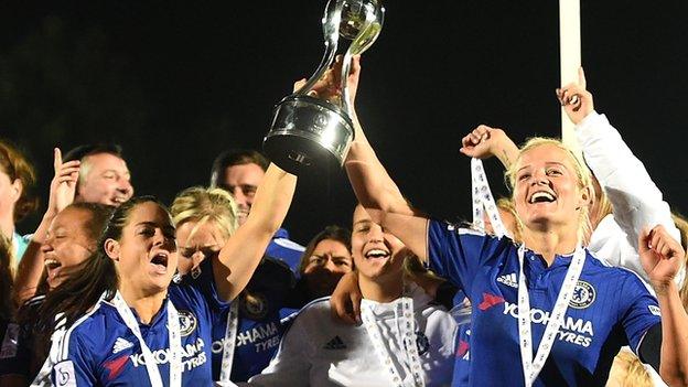 Chelsea players hold up WSL trophy