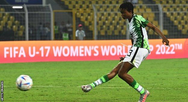 Comfort Folorunsho takes a penalty against Colombia