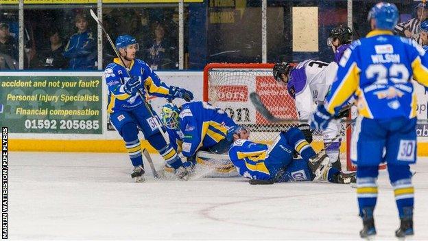 Fife Flyers' Shane Owen makes a save from Jay Rosehill of Braehead Clan in Monday's meeting in Kirkcaldy