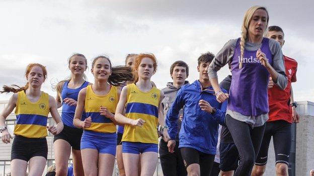 Eilish McColgan (right) presented the Lindsays Cross Country trophy to Glasgow club Giffnock North AAC