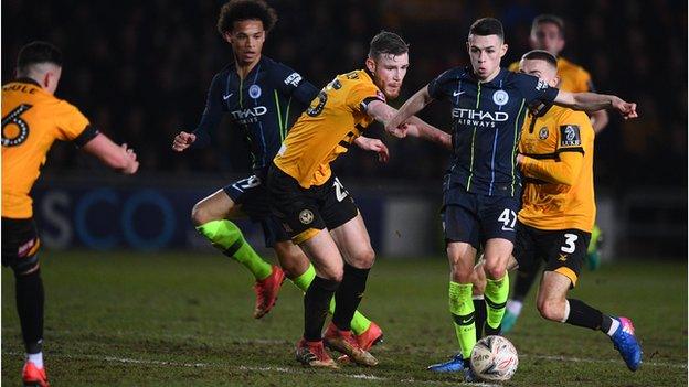 Newport County's defence tries to contain Phil Foden of Manchester City during an FA Cup Fifth Round at Rodney Parade