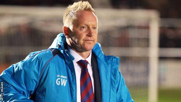 Aldershot Town boss Gary Waddock on the sidelines