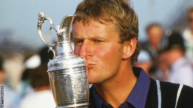 Sandy Lyle receives the Claret Jug after winning the Open in 1985