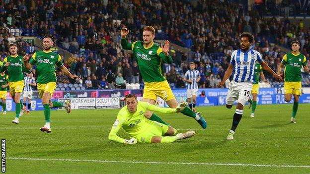 Sepp van den Berg scores an own goal