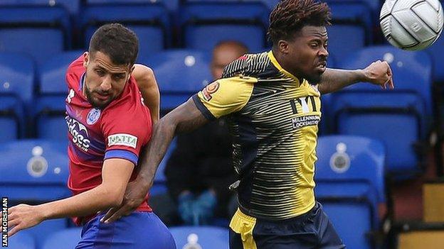 Mo Bettamer in action for Aldershot against Woking