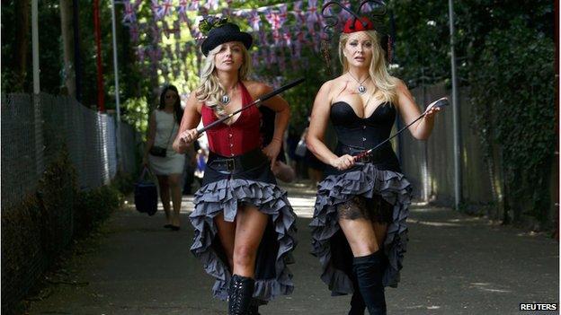 Anti-horse racing activists Polish pop star Pola Pospieszalska (L) and model Victoria Eisermann pose outside Ascot race course on Ladies Day, just south of London