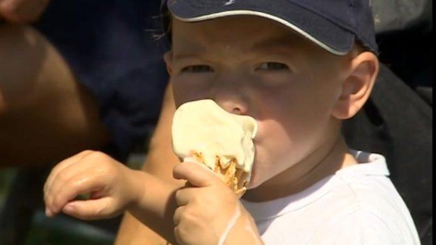 Boy eating a melting ice-cream