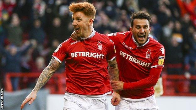 Nottingham Forest players Jack Colback and Joao Carvalho celebrate a goal against Leeds United