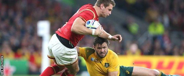 Adam Ashley-Coooper tackles Wales fly-half Dan Biggar