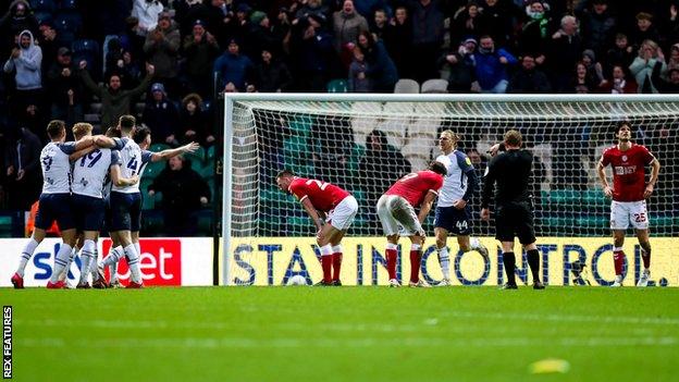 Preston players celebrate their 95th minute equaliser against Bristol City