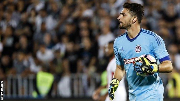 Stefanos Kapino in action for Olympiacos during a Champions League qualifying match