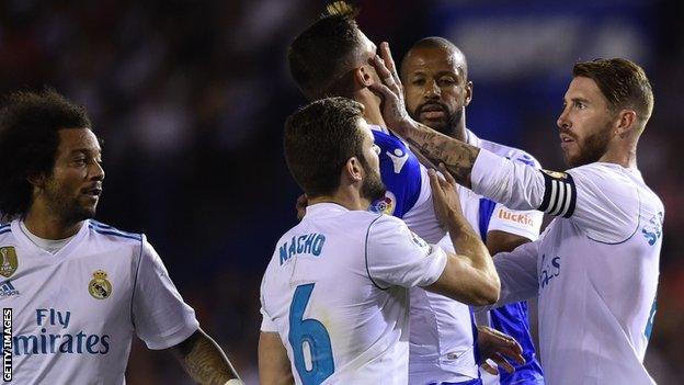 Sergio Ramos shoves Fabian Schar's face