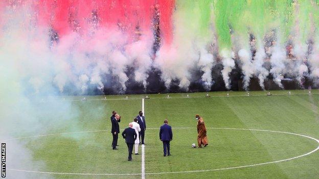 A ceremonial kick-off at the Abdoulaye Wade Stadium