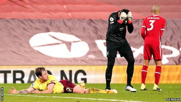 Liverpool goalkeeper Alisson reacts after conceding a penalty to Burnley