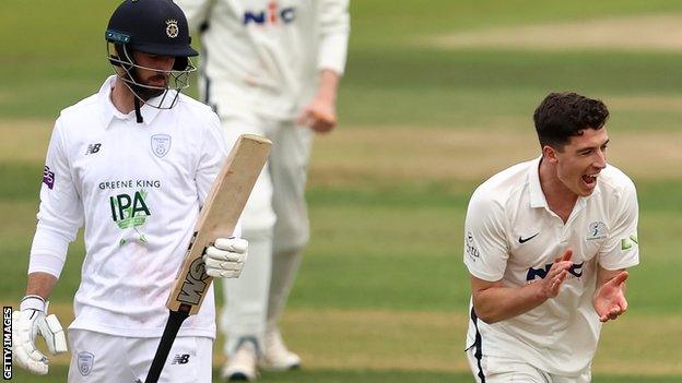 Matt Fisher celebrates the wicket of James Vince