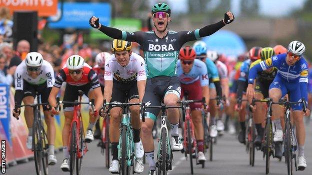 Sam Bennett celebrates winning stage three of the 2019 Criterium du Dauphine