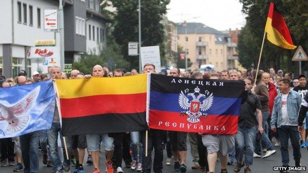 Demonstrators march in Heidenau, eastern Germany, on 28 August 2015