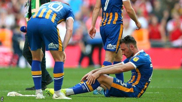 Shrewsbury Town players dejected at Wembley