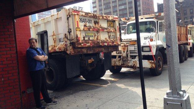 In New York Mr Obama is protected by police officers - and dump trucks