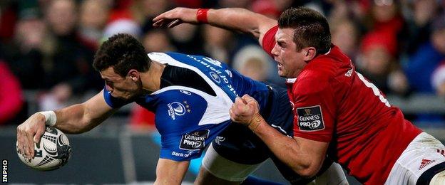 Zane Kirchner dives over for Leinster's first-half try despite CJ Stander's efforts