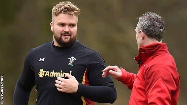 Tomas Francis in conversation with Wales coach Rob Howley during a training session