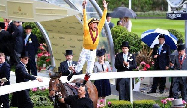 Frankie Dettori performs a flying dismount from Lady Aurelia