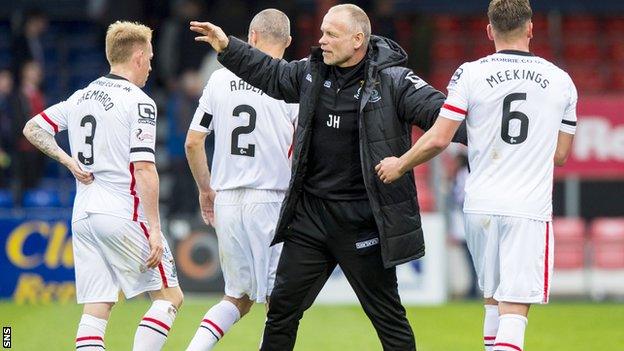 John Hughes congratulates his victorious players