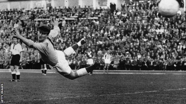 Northern Ireland keeper Harry Gregg fails to stop Germany's Uwe Seeler from scoring in the World Cup match in Sweden in 1958