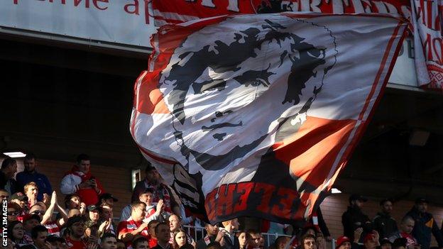 A giant banner brandished by Spartak Moscow fans depicts Fyodor Cherenkov