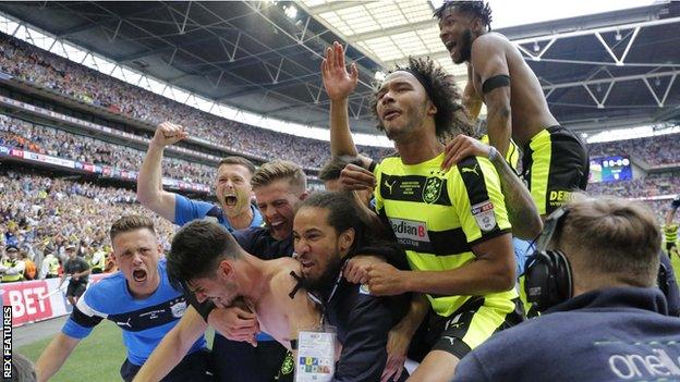 Huddersfield Town celebrate after winning promotion to the Premier League