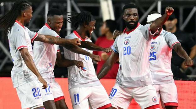 Haiti's forward #20 Frantzdy Pierrot celebrates with teammates after scoring his team's third goal during an international friendly football match between Haiti and New Zealand at Inter Miami CF Stadium in Fort Lauderdale, Florida on June 2, 2026.