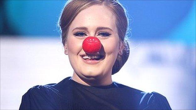 Adele wearing a red nose