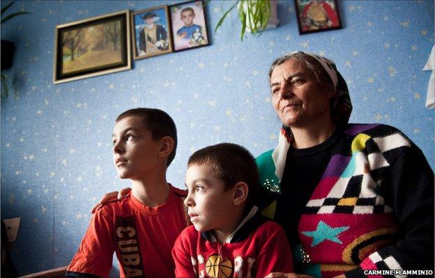 Valentino and Nikita with their grandmother in Miclesti