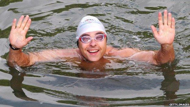 David Walliams waving from the River Thames