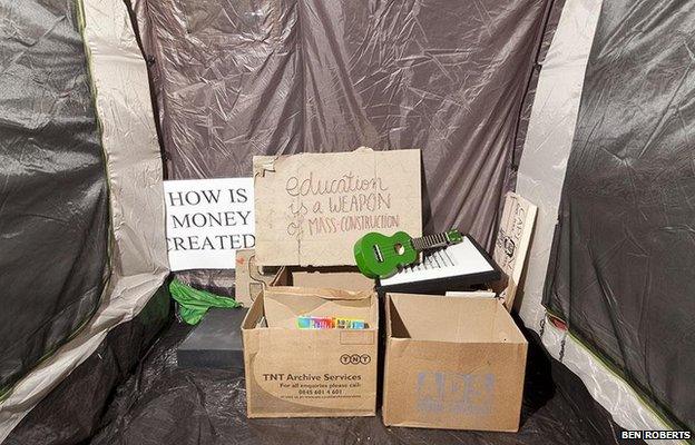 Library Storage Tent, St Paul’s Camp. The library is running on donated books from volunteers and supporters