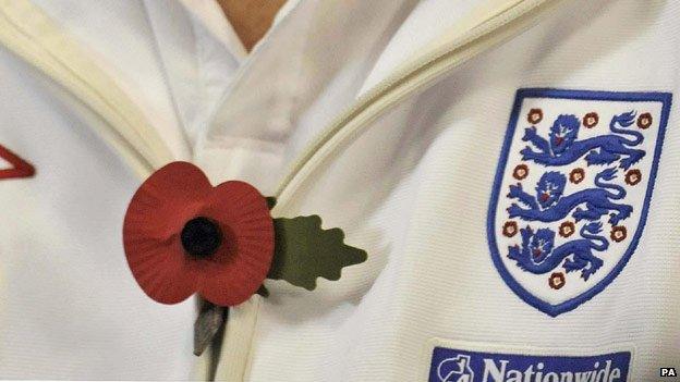 An England player wearing a poppy