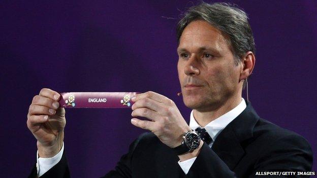 Marco van Basten from the Netherlands holds up England's slip during the Euro 2012 draw