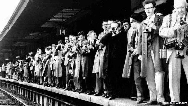 Photographers on platform 14 at York Station wait for The Beatles to arrive, 9 August 1964